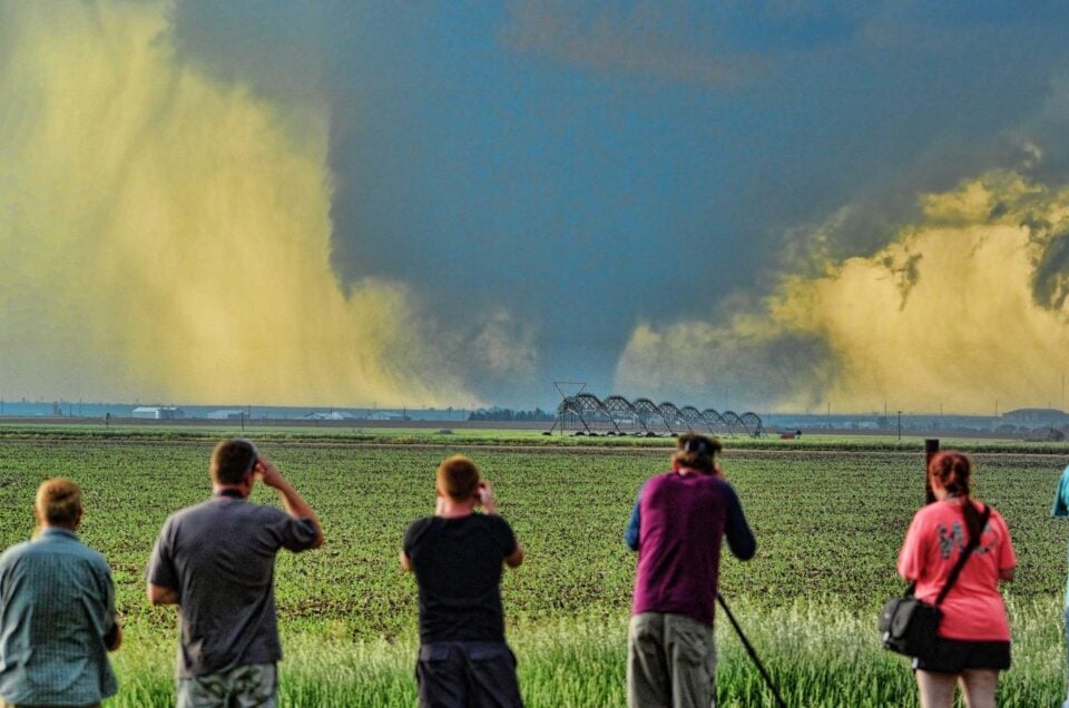 Tornado forming over open farmland in Tornado Alley during peak chase season